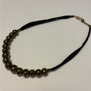 Necklace: black ribbon with metallic beads